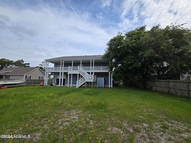 rear view of house with a lawn