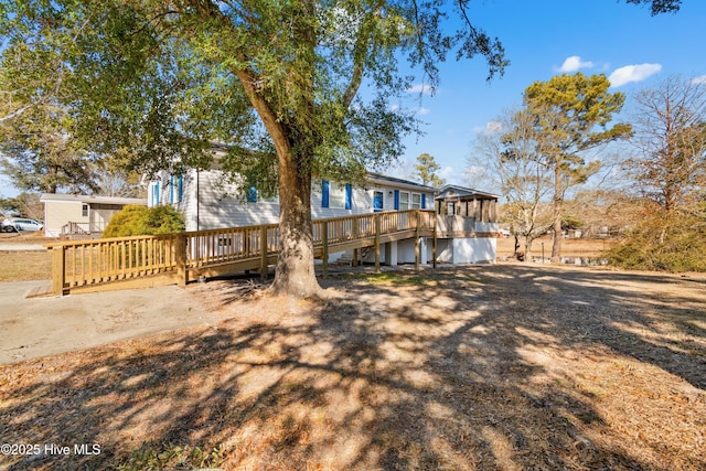 rear view of property with a deck