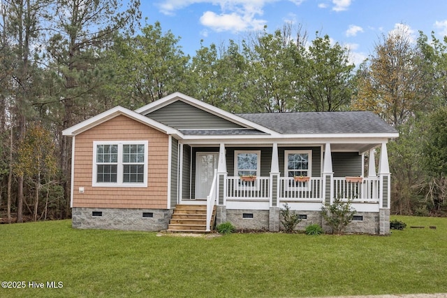 view of front facade featuring covered porch and a front yard