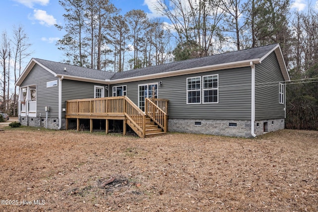 back of house featuring a wooden deck