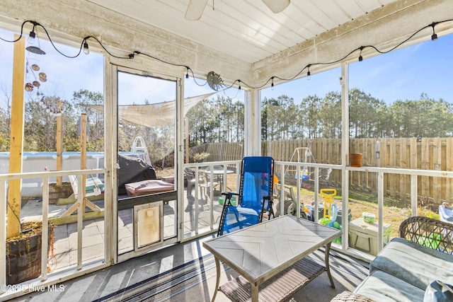 sunroom / solarium with ceiling fan and plenty of natural light