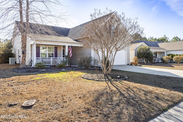 ranch-style home with central AC, covered porch, a front yard, and a garage