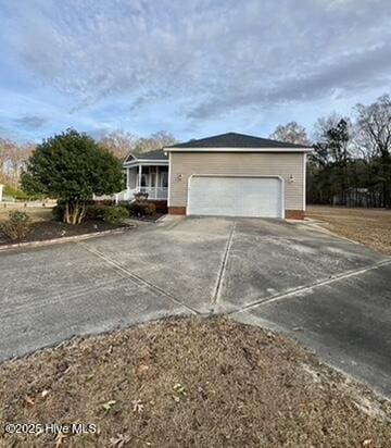 view of front of house featuring a garage and covered porch