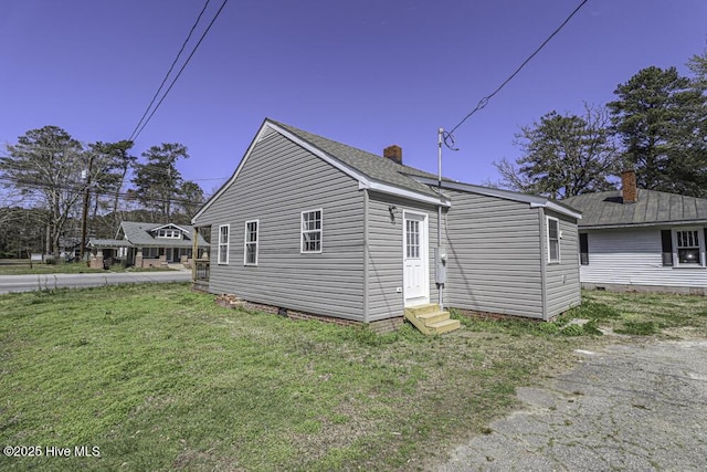 view of home's exterior featuring a lawn