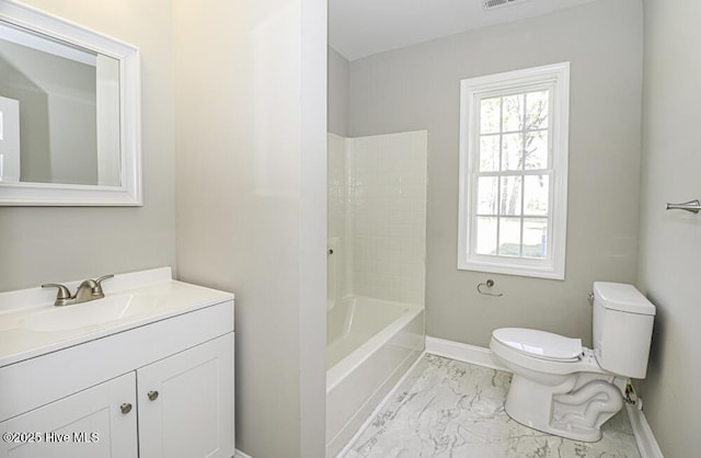 full bathroom with washtub / shower combination, vanity, and toilet