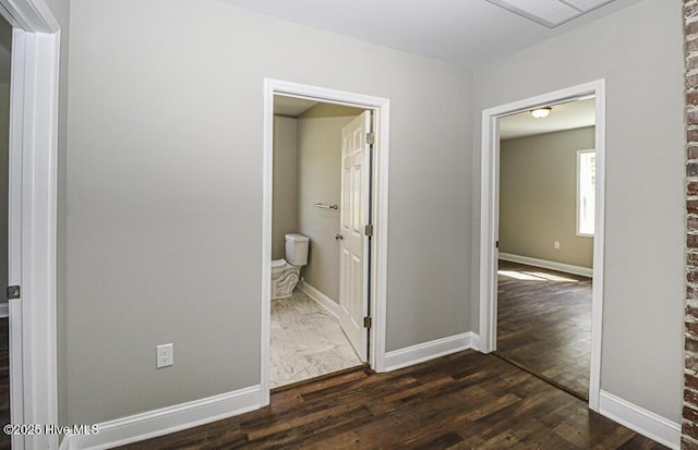 corridor featuring dark hardwood / wood-style flooring