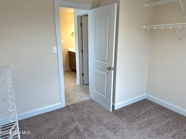 interior space with light colored carpet and a closet