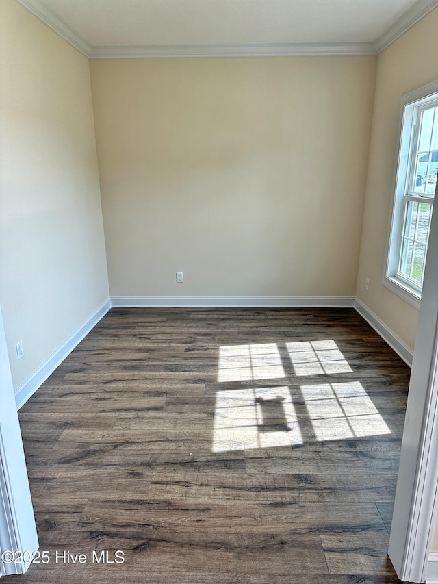 unfurnished room featuring dark wood-type flooring and ornamental molding