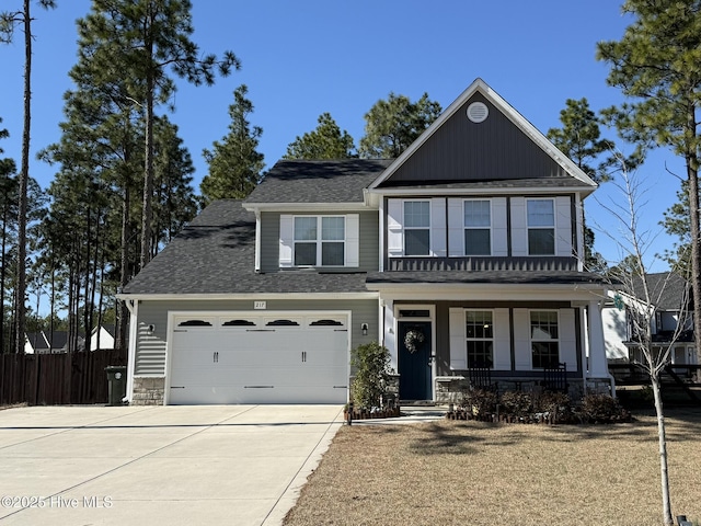 view of front of home featuring a porch and a garage