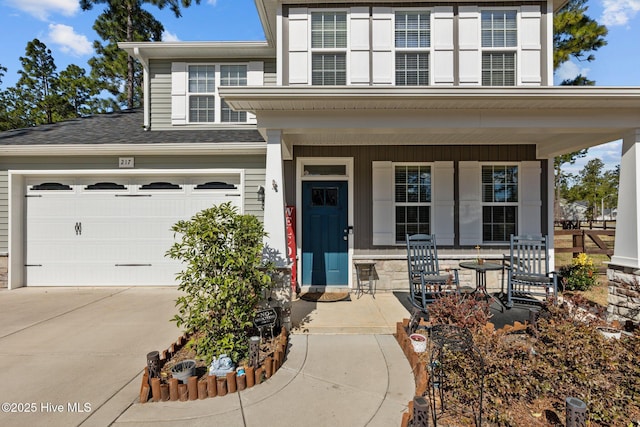 view of front of house featuring covered porch and concrete driveway