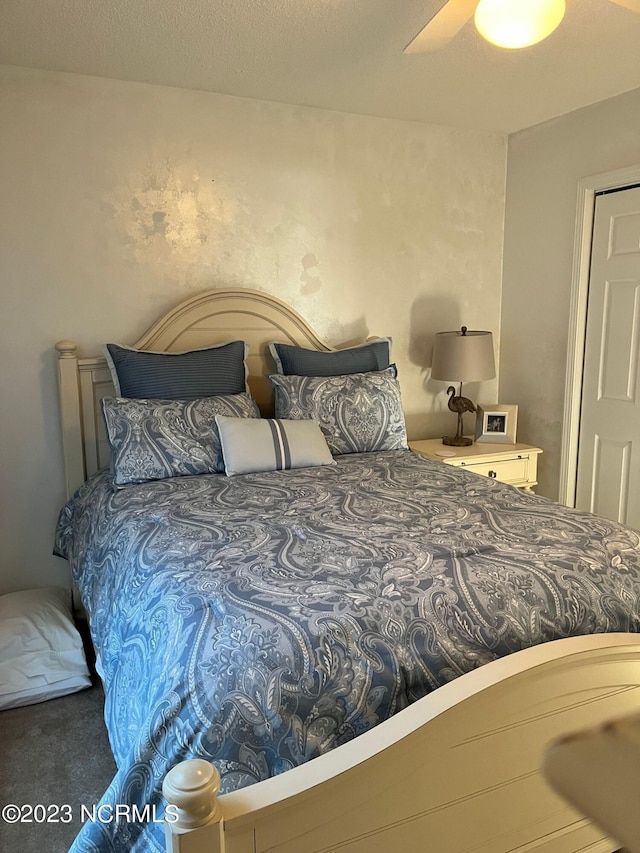 carpeted bedroom featuring ceiling fan