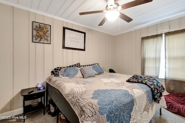 bedroom featuring crown molding, a ceiling fan, and carpet floors