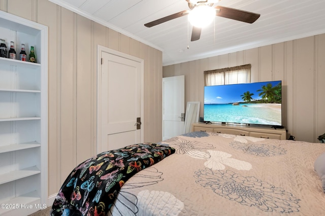 bedroom featuring crown molding and a ceiling fan