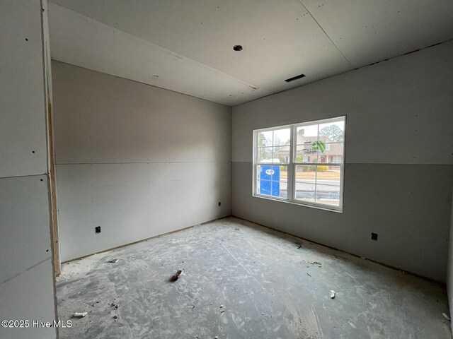 carpeted empty room featuring a raised ceiling, ceiling fan, and crown molding