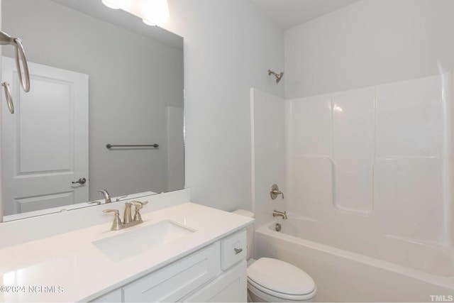 bathroom with toilet, tub / shower combination, and vanity