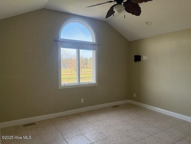 spare room featuring ceiling fan and lofted ceiling