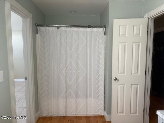 bathroom featuring shower / bath combo with shower curtain