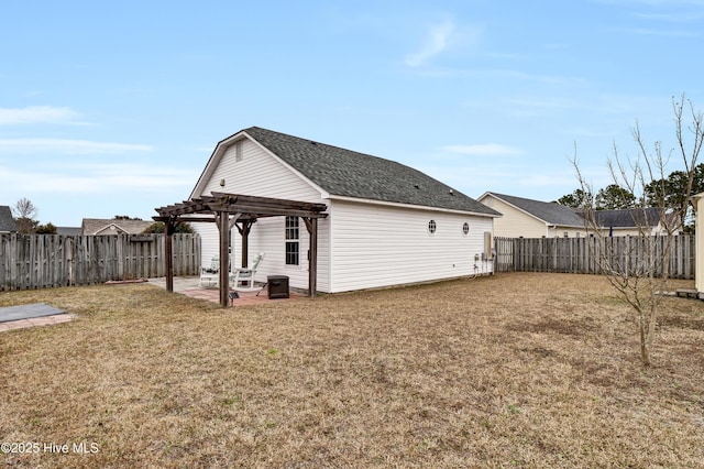 back of house with a patio area, a pergola, and a yard