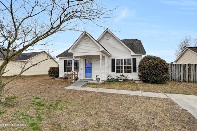 bungalow-style house with a front lawn