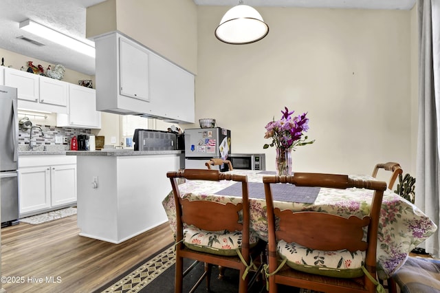 dining room featuring light hardwood / wood-style flooring