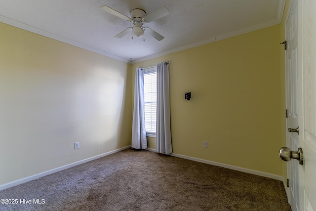 carpeted empty room with ceiling fan and crown molding