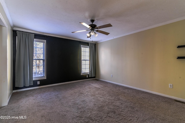 carpeted spare room with ceiling fan, ornamental molding, and a textured ceiling