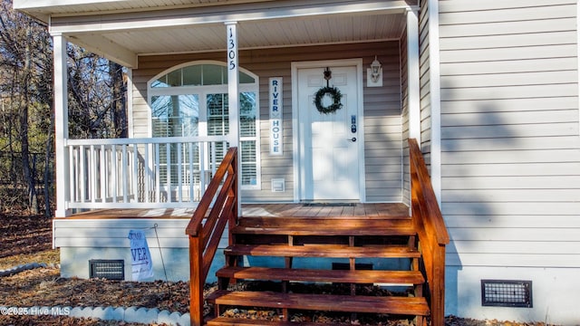 doorway to property featuring a porch