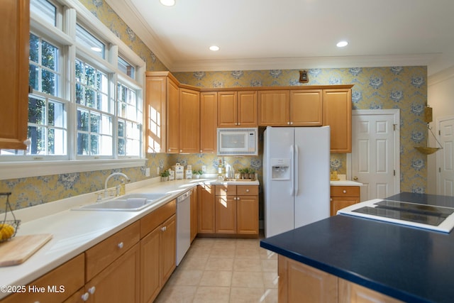 kitchen featuring crown molding, sink, light tile patterned flooring, and white appliances