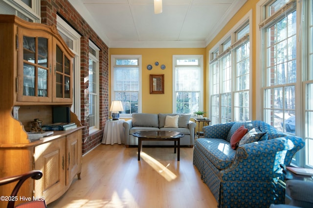 sunroom / solarium featuring a healthy amount of sunlight