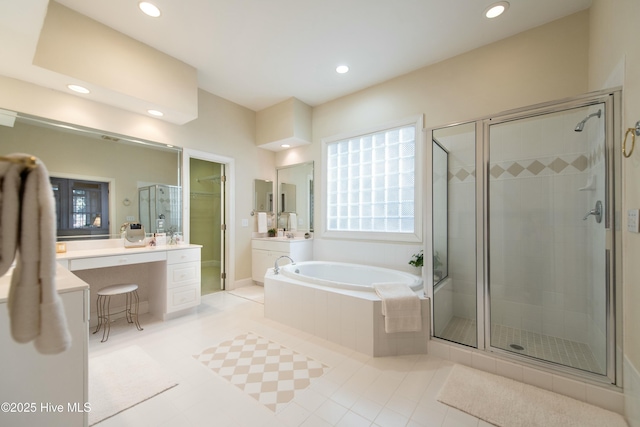 bathroom featuring tile patterned floors, vanity, and independent shower and bath