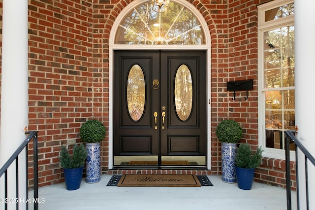 view of exterior entry featuring french doors