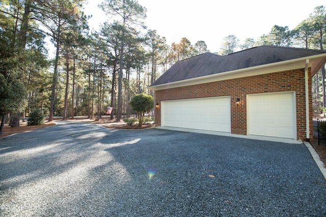 view of property exterior with a garage