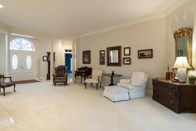 interior space with crown molding, ornate columns, and light carpet