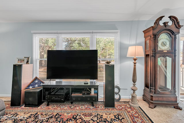 carpeted living room featuring a healthy amount of sunlight