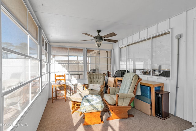 sunroom / solarium featuring ceiling fan