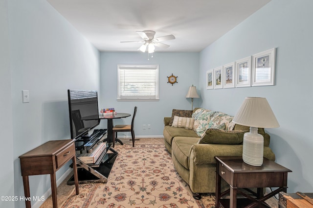 carpeted living room with ceiling fan