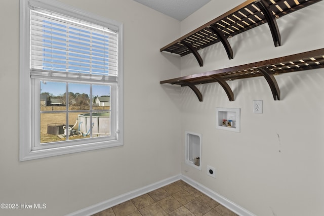 laundry area featuring tile patterned flooring, washer hookup, and electric dryer hookup