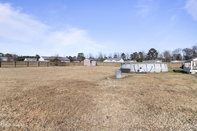 view of yard featuring a storage unit