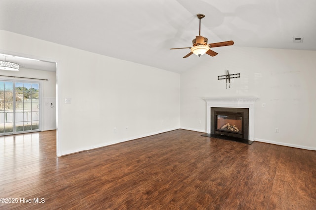 unfurnished living room with lofted ceiling, ceiling fan, and dark hardwood / wood-style floors