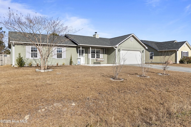 single story home with a front lawn and a garage