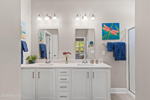 bathroom with walk in shower and vanity