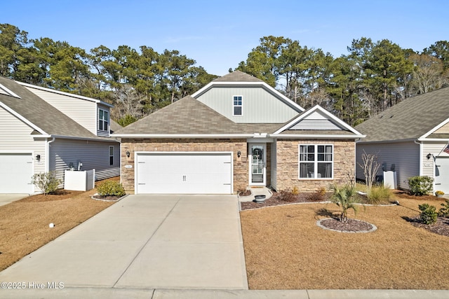 view of front of property with a front lawn and a garage