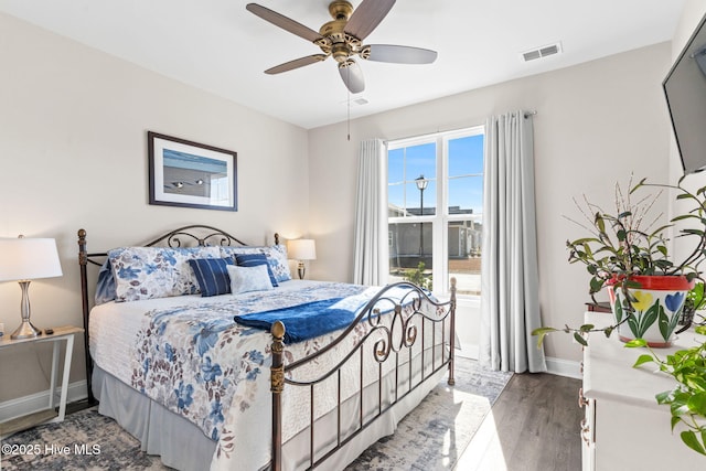 bedroom featuring ceiling fan and hardwood / wood-style flooring