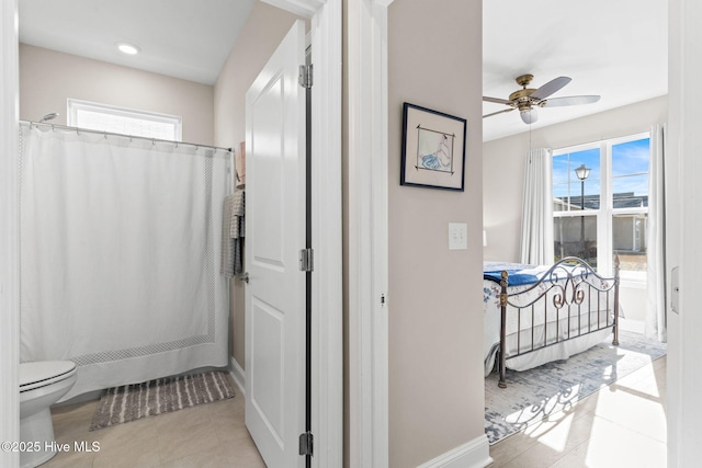 bathroom with toilet and ceiling fan