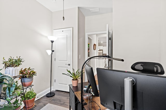 exercise room with dark wood-type flooring