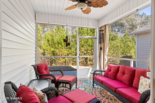 sunroom / solarium featuring ceiling fan and a wealth of natural light