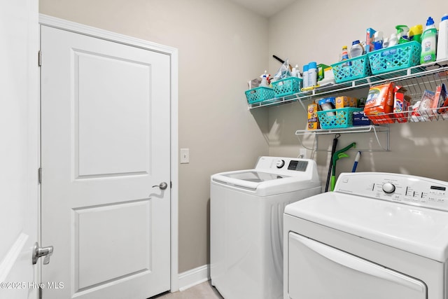 clothes washing area featuring independent washer and dryer