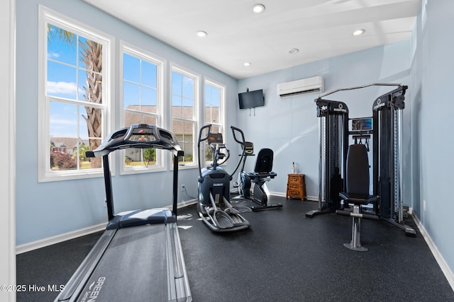 exercise area featuring a wall unit AC