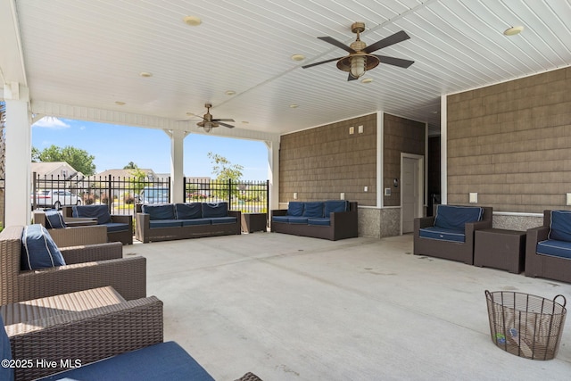 view of patio with ceiling fan and outdoor lounge area