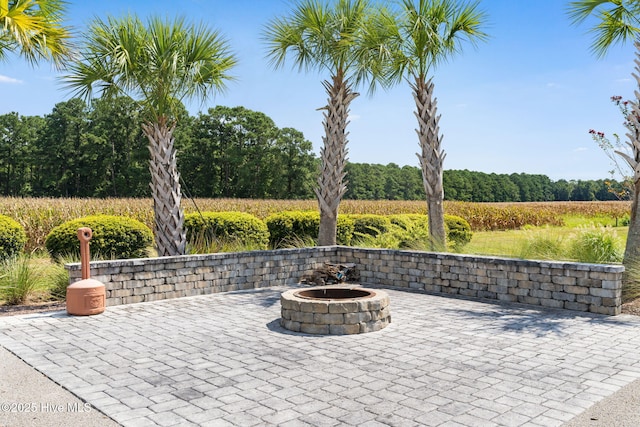 view of patio with an outdoor fire pit